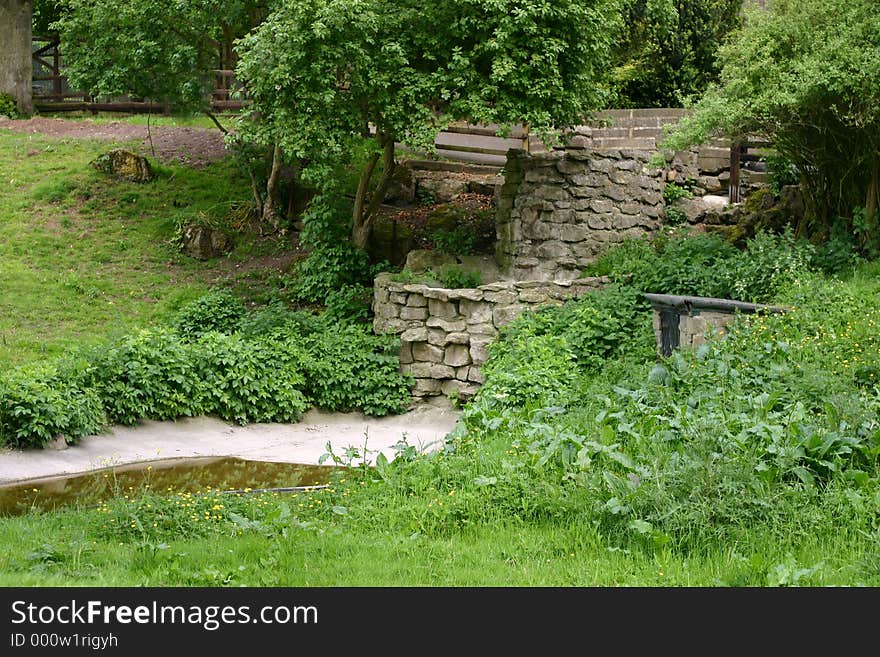 Beautiful green countryside, with stream and wall. Beautiful green countryside, with stream and wall