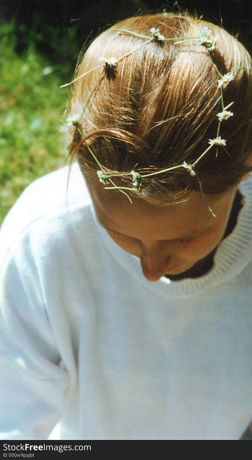 Original photograph of a girl with a wreath of daisies in her hair. Original photograph of a girl with a wreath of daisies in her hair.