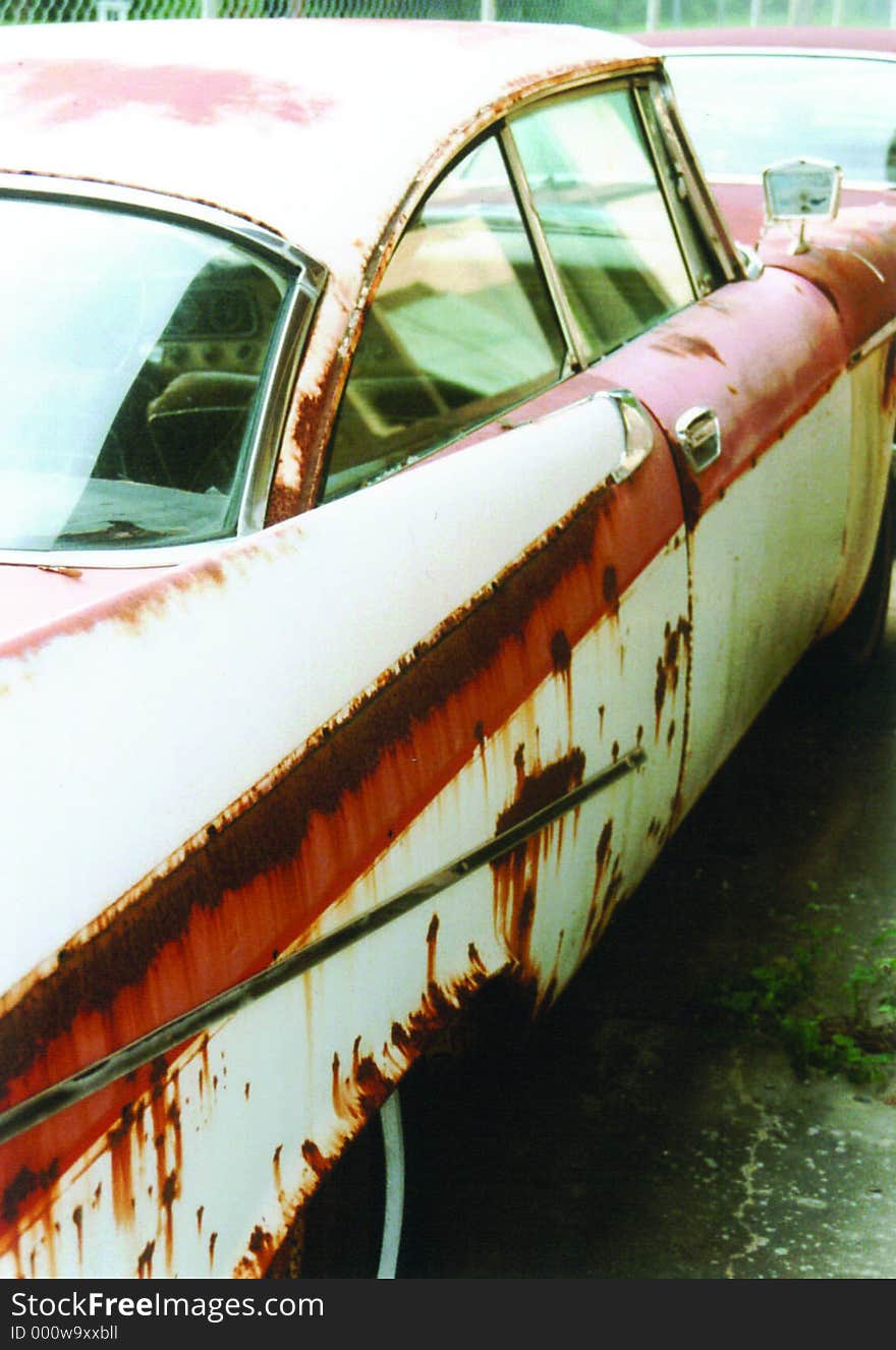 Original photo of a junk yard car.