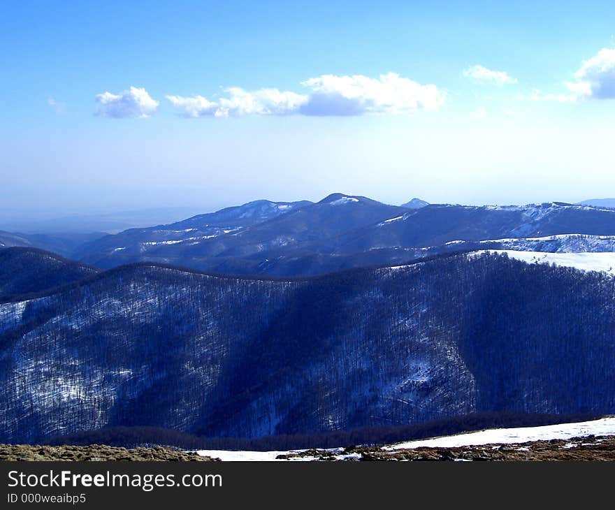 Here are some mountains in Romanian full of snow and trees. Here are some mountains in Romanian full of snow and trees.