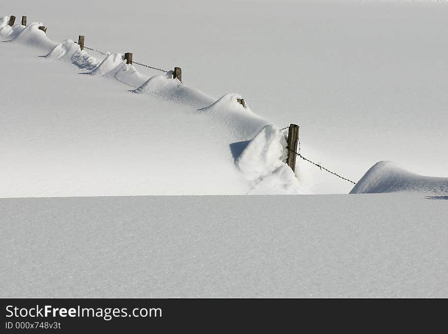 A snowy fence. A snowy fence