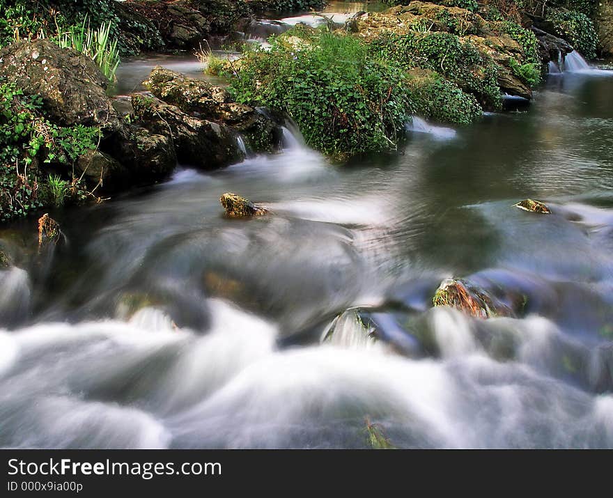 River rapid shot taken with slow shutter speed. River rapid shot taken with slow shutter speed