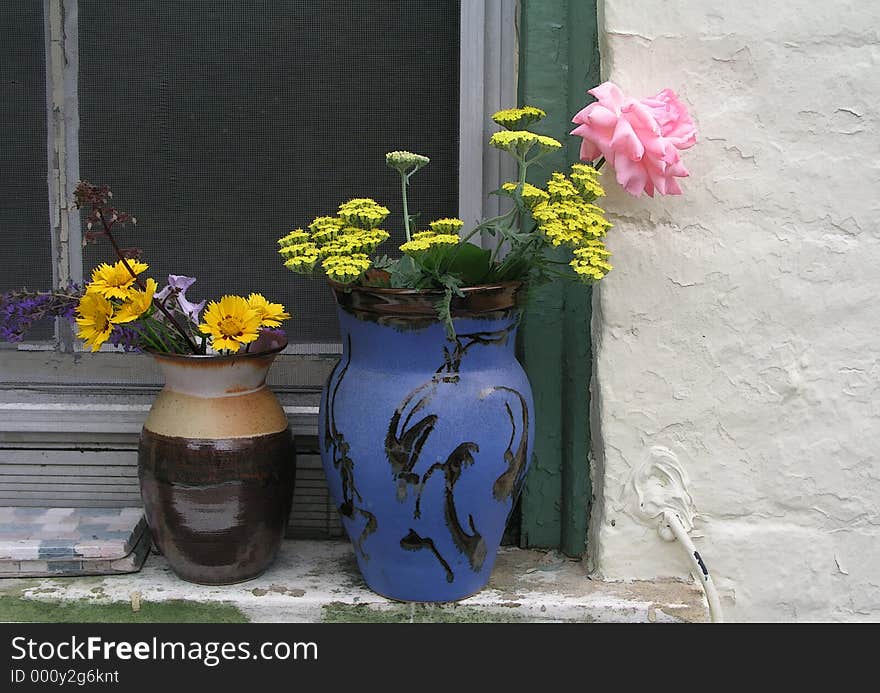 Vases with a variety of flowers creates a peaceful, soothing composition. Vases with a variety of flowers creates a peaceful, soothing composition.