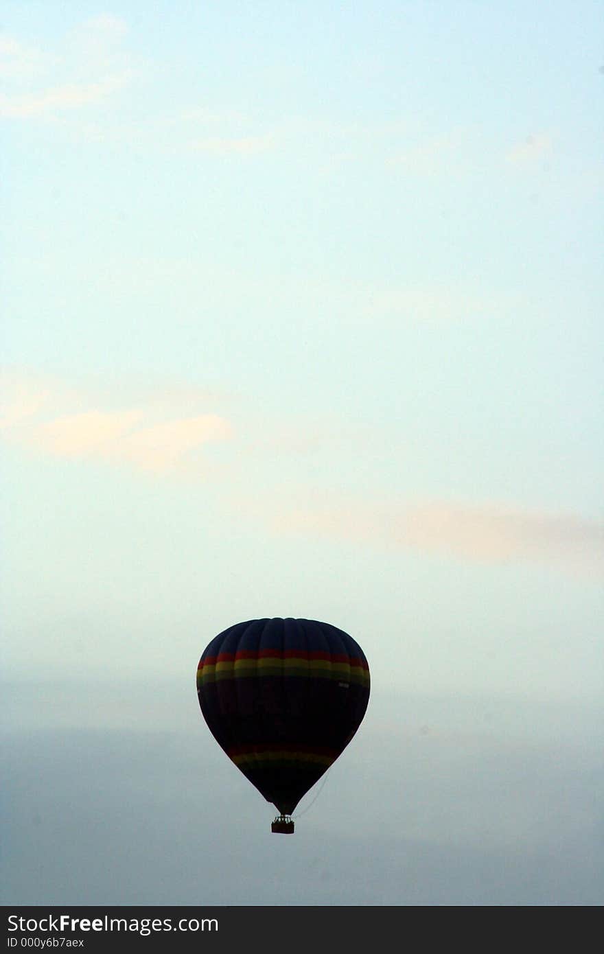 Silhouette of a hot air balloon at dusk