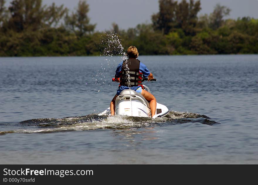 Lady on a jet ski. Lady on a jet ski