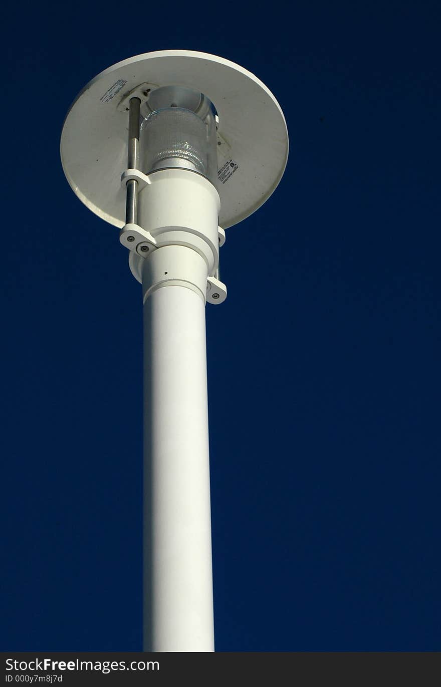 Electric lamp in park on a sunny day. Electric lamp in park on a sunny day