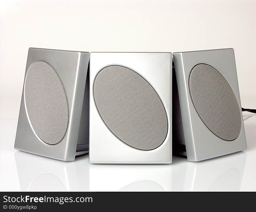Three computer speakers. Three computer speakers