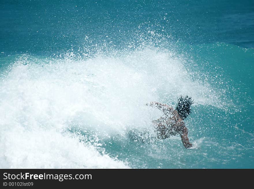 Surfer wipes out. Surfer wipes out