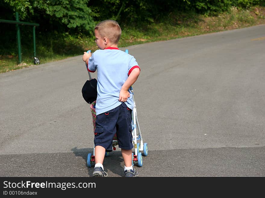 Five year old boy in park having trouble with jeans. Shot with Canon 20D. Five year old boy in park having trouble with jeans. Shot with Canon 20D.