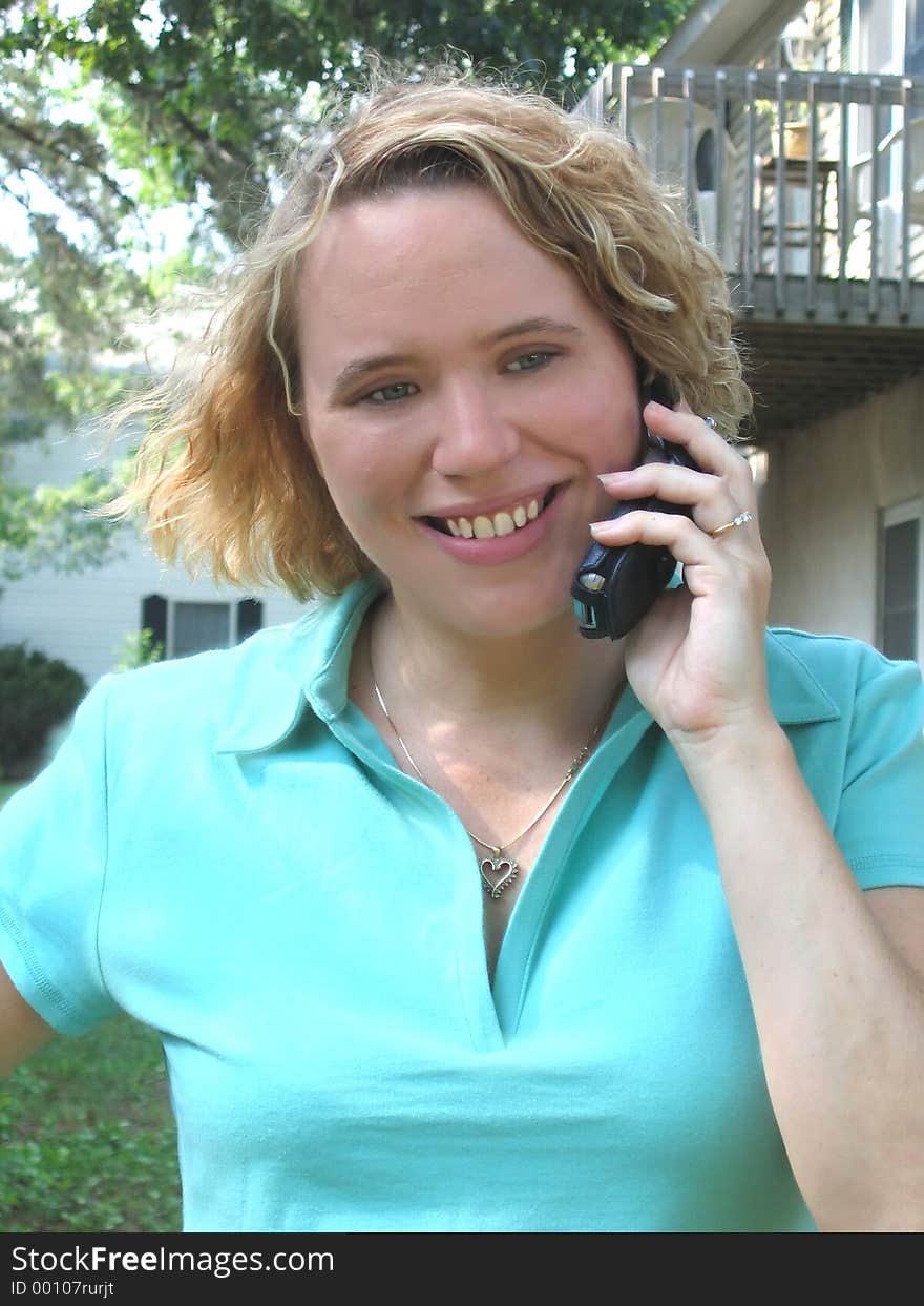 Young woman on the phone outdoors