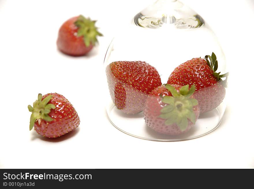 This is a composition of a strawberry below hooter. This is a composition of a strawberry below hooter