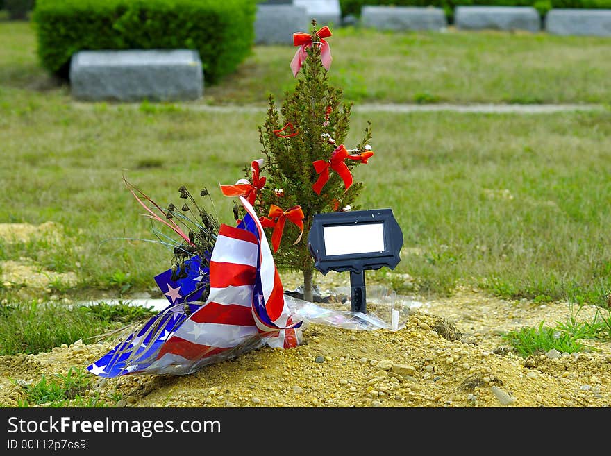 Grave With Flowers and a Tree. Grave With Flowers and a Tree