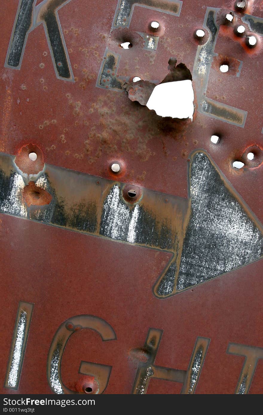 keep right sign, rusting and laden with bullet holes. keep right sign, rusting and laden with bullet holes