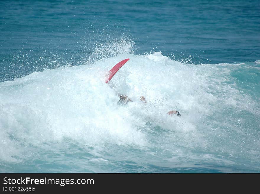 Surfer wipes out. Surfer wipes out