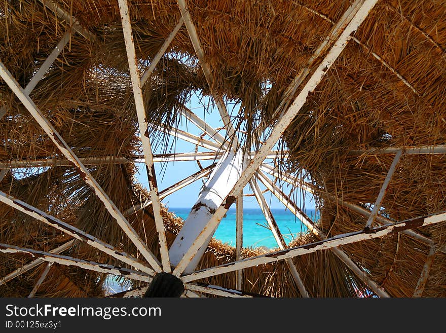 A leaky sunshade on the beach...