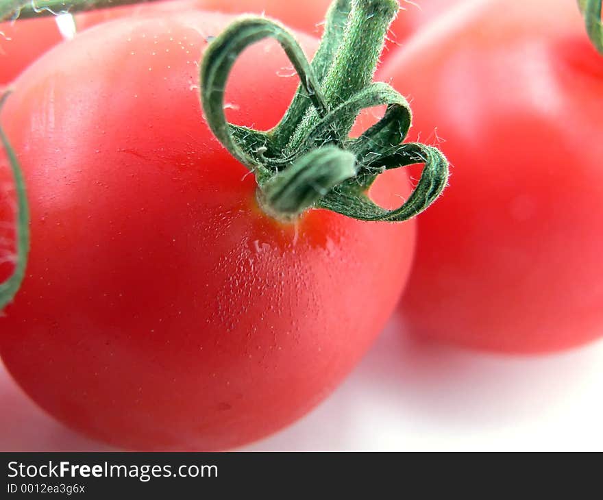 A macro of a cherry tomato. A macro of a cherry tomato