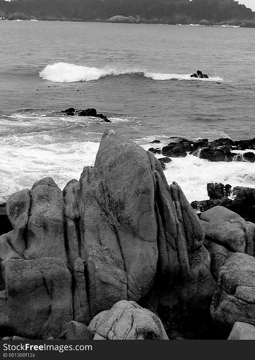 A sea-splashed rock off the California coast in black & white. A sea-splashed rock off the California coast in black & white.