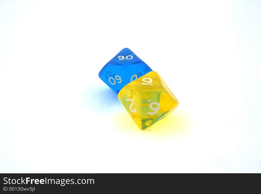 Closeup of yellow and blue dices. Closeup of yellow and blue dices