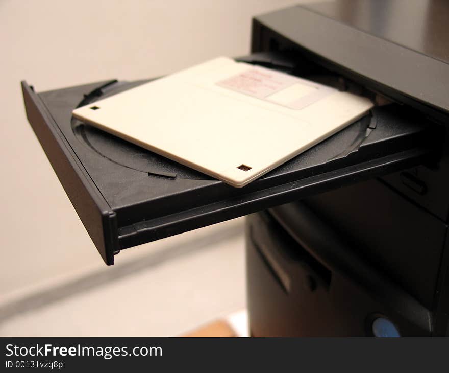 A diskette inserted in the CD tray of a computer. A diskette inserted in the CD tray of a computer