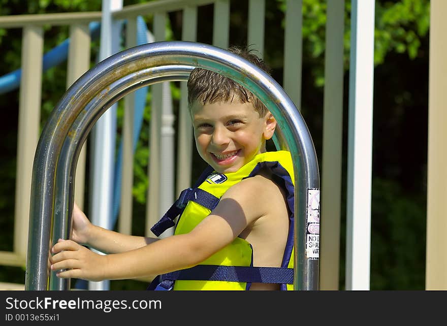 Young Boy Sitting on Pool Stairs. Young Boy Sitting on Pool Stairs