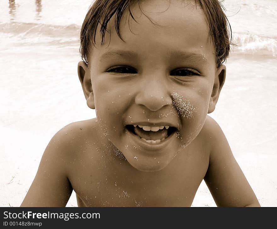 Boy on beach smiling