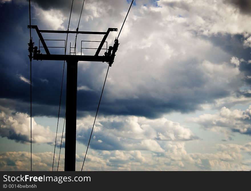 A ski lift at mount Tremblant with dark cloud behind