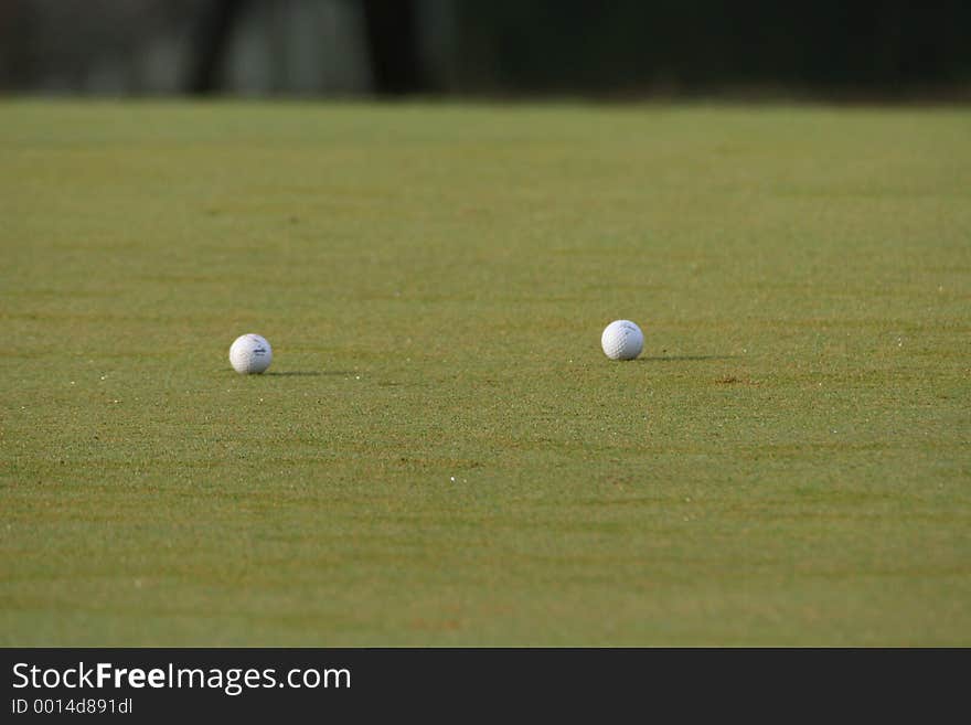 Two golf balls taken in the early morning on the green. Two golf balls taken in the early morning on the green.