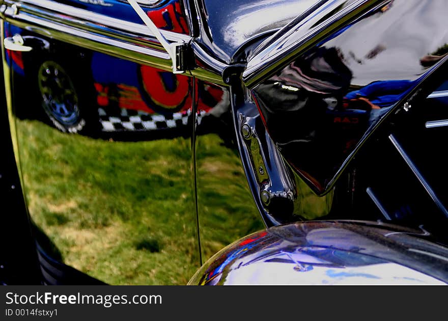 Car show at the fairgrounds, Check out the reflections of the formula car next to the classic