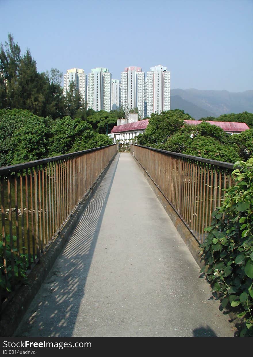 Long narrow bridge leads to human habitat. Long narrow bridge leads to human habitat.