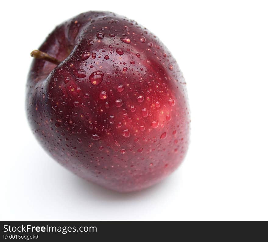 Isolated red apple with water droplets. Isolated red apple with water droplets