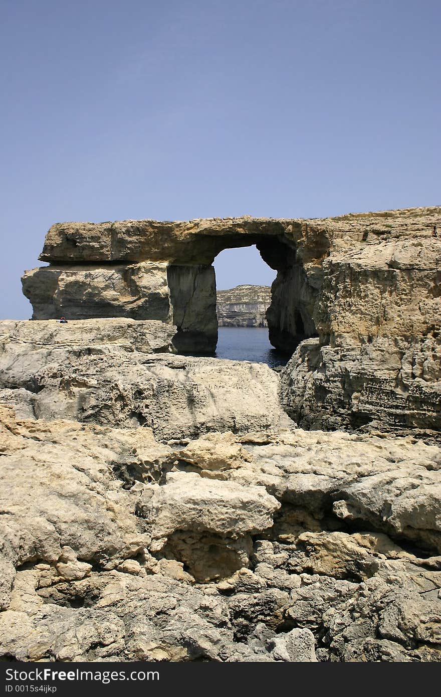 Huge rock formations at Dwejra, Gozo, Malta. This naturally cut window is better known as the Azure Window. Huge rock formations at Dwejra, Gozo, Malta. This naturally cut window is better known as the Azure Window.