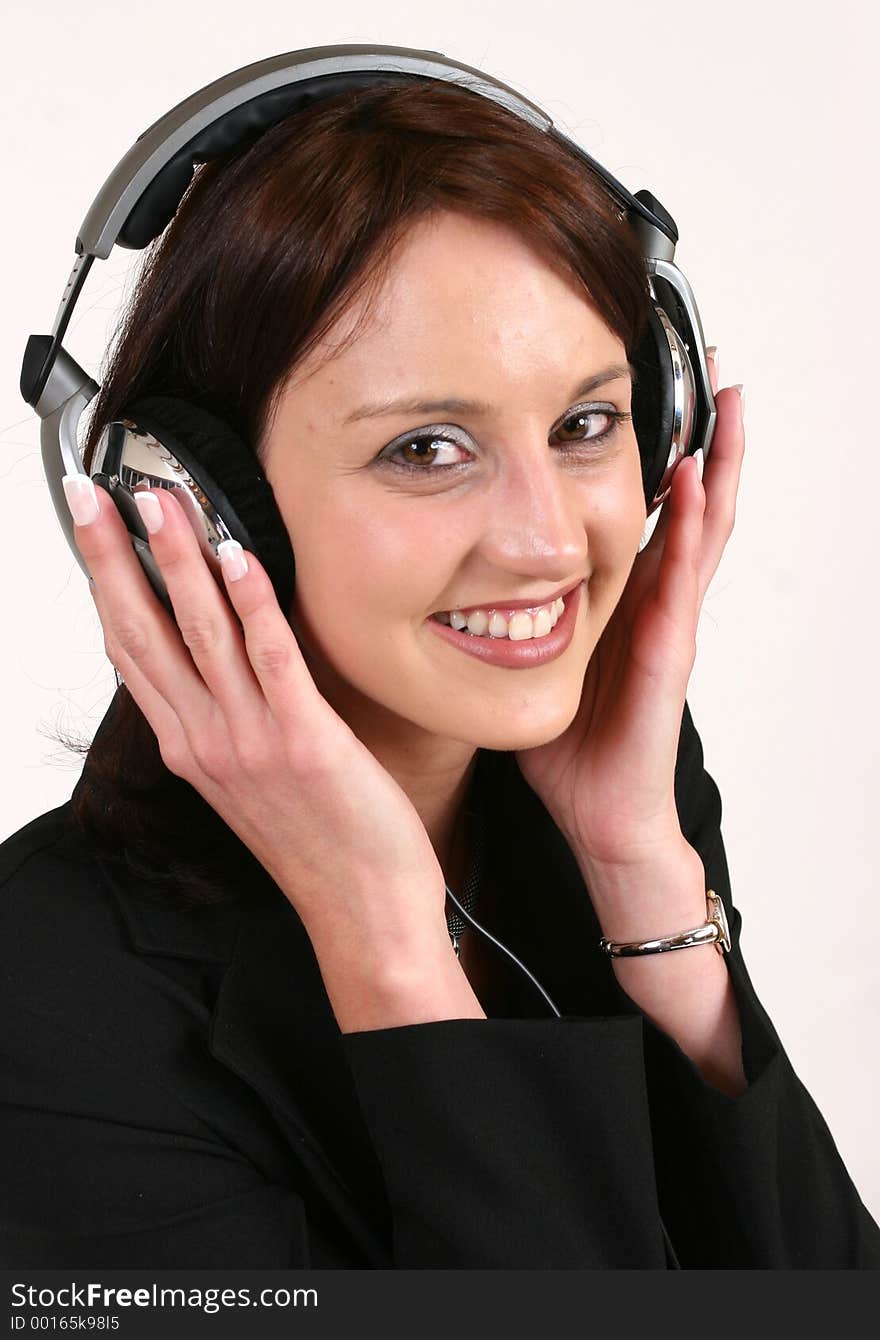 Businesswoman listening to music