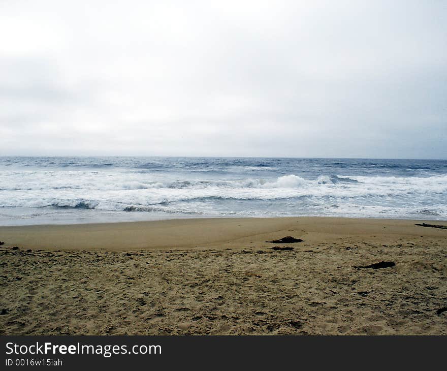 Cold Beach with Dark Blue water