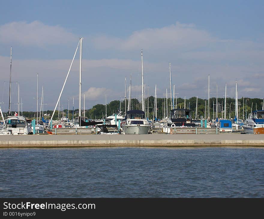 Sailboats docked on an overly windy day. Sailboats docked on an overly windy day