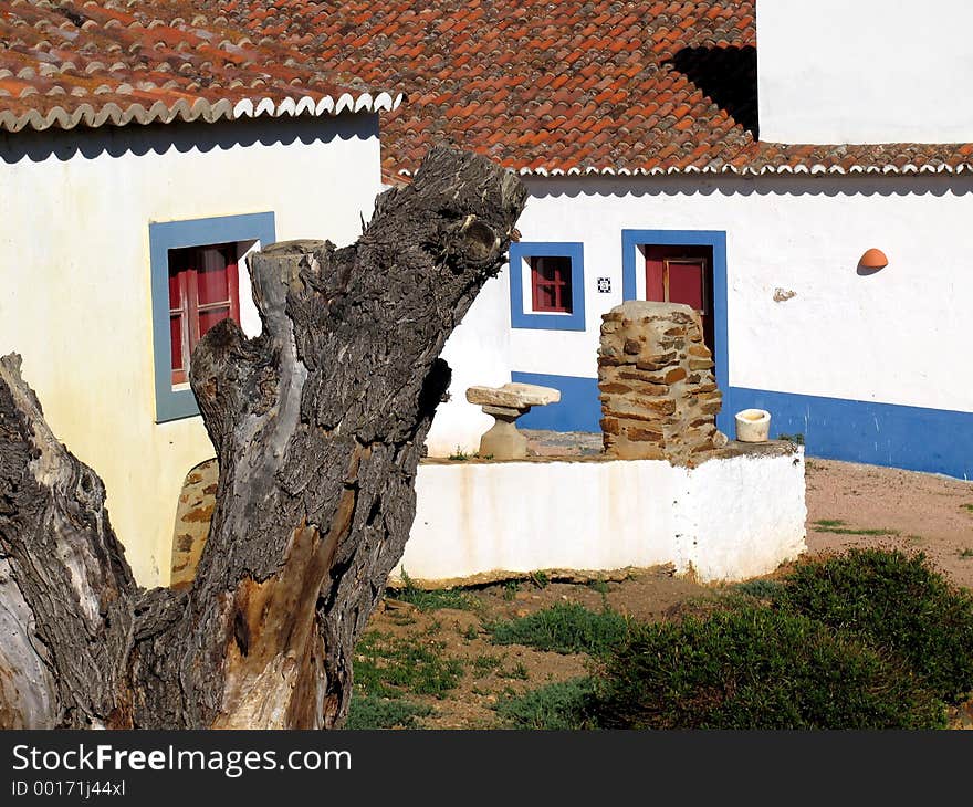 Traditional rural house of the south of Portugal. The colors are typical, with white walls (to minimize the heat of the sun) and blue frames. Traditional rural house of the south of Portugal. The colors are typical, with white walls (to minimize the heat of the sun) and blue frames