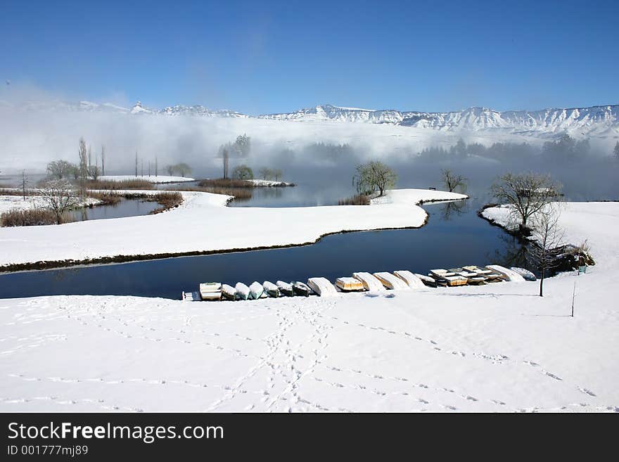 Landscape photo of snow on the mountains and around lake. Landscape photo of snow on the mountains and around lake