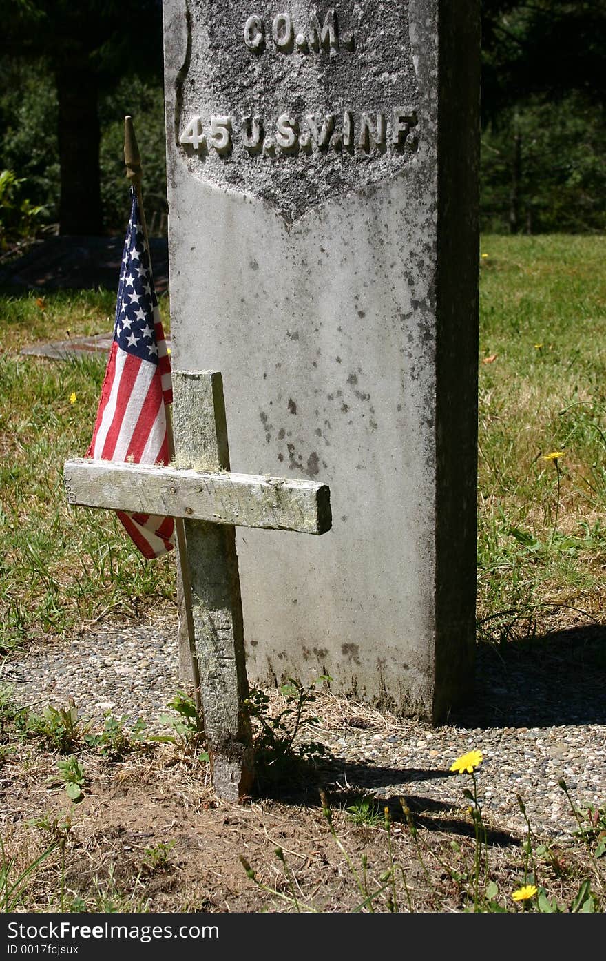 A gravesight off by itself with the obvious markings of armed service their is multiple feelings felt here. A gravesight off by itself with the obvious markings of armed service their is multiple feelings felt here