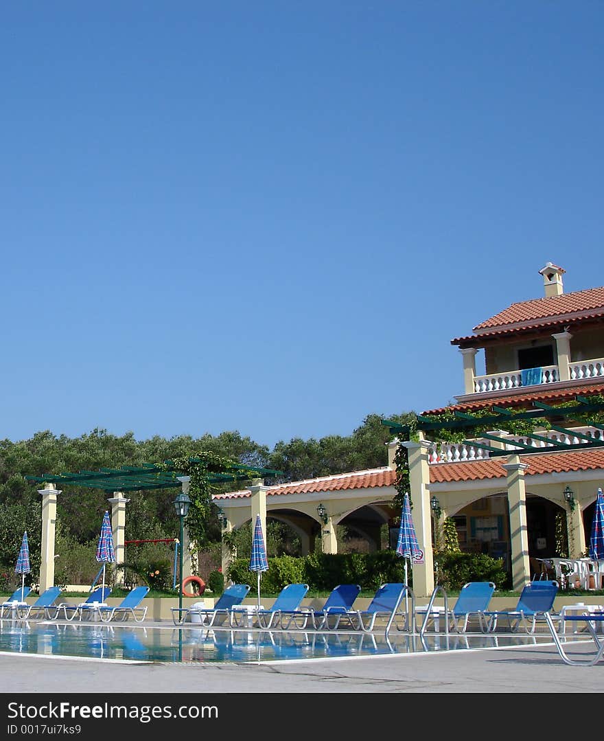 Swimming pool and hotel on a sunny day