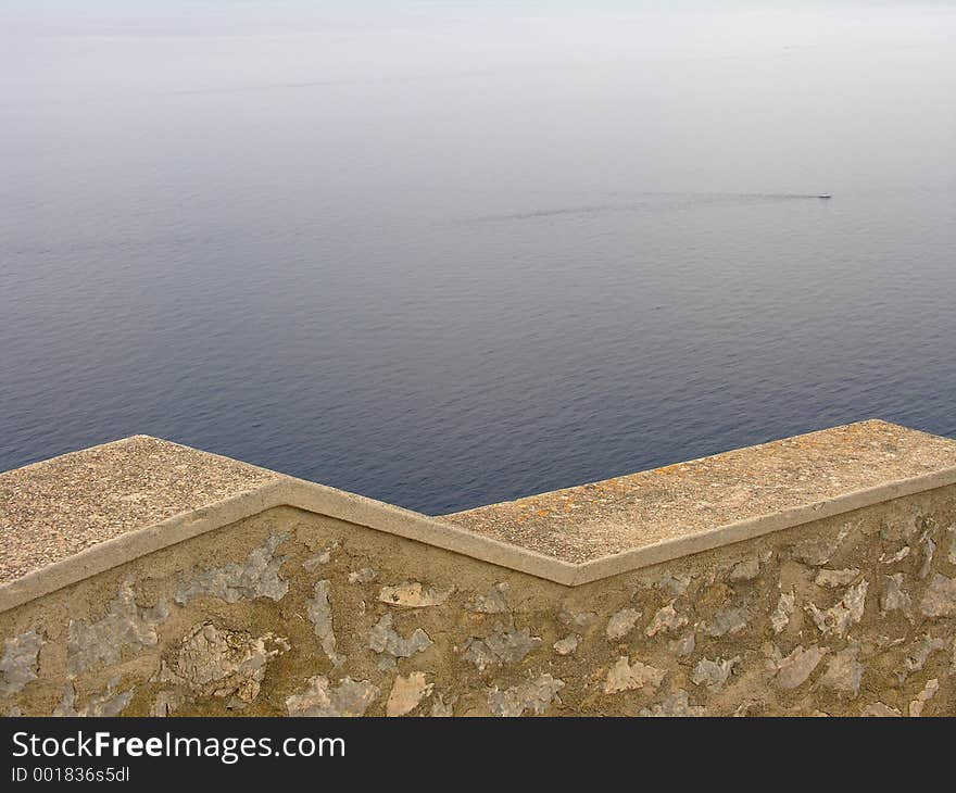 A balustrade high above the mediterranean sea