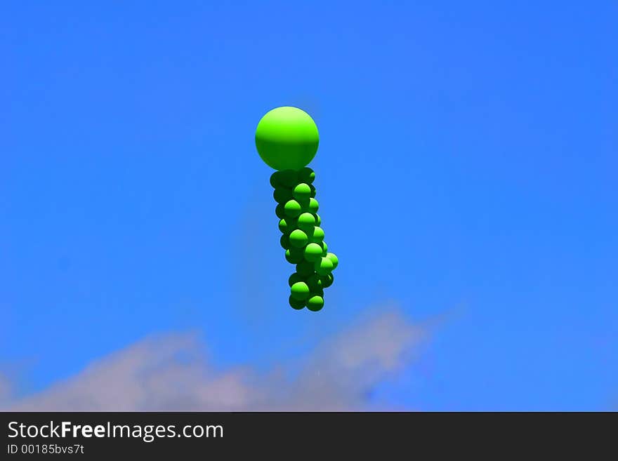 Green balloons against bright blue sky. Green balloons against bright blue sky