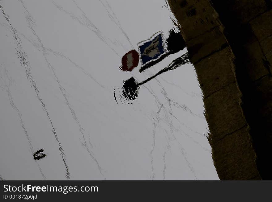 A reflection in a puddle on a rainy day in Saint-Petersburg, Russia. A reflection in a puddle on a rainy day in Saint-Petersburg, Russia.