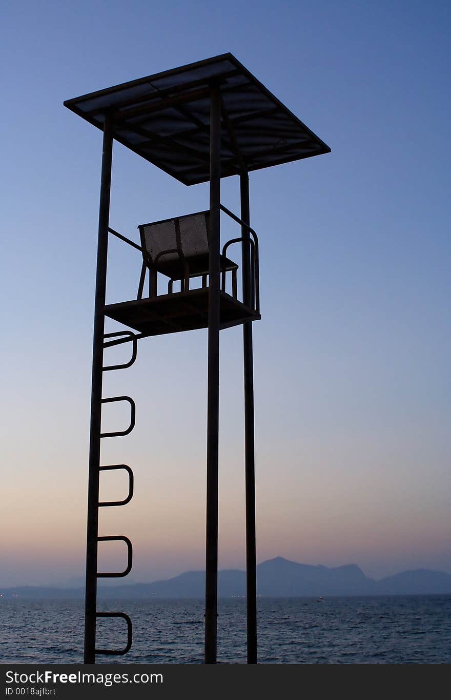 A lookout tower on the beach at sunset. A lookout tower on the beach at sunset...