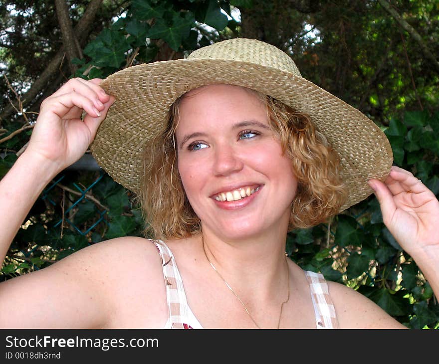 Pretty young woman in straw hat. Pretty young woman in straw hat