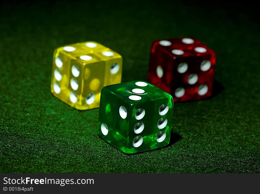 Photo of a Red, Yellow and Green Dice. Photo of a Red, Yellow and Green Dice.