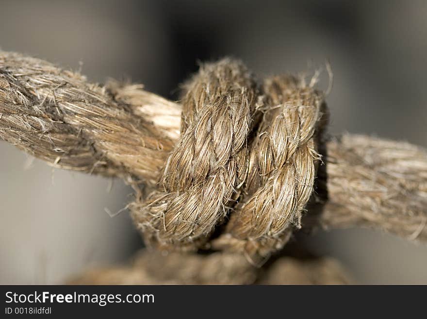 Macro shot of a knot on the old rope