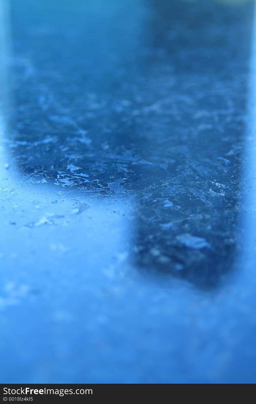 Building reflected to marble bench. Building reflected to marble bench