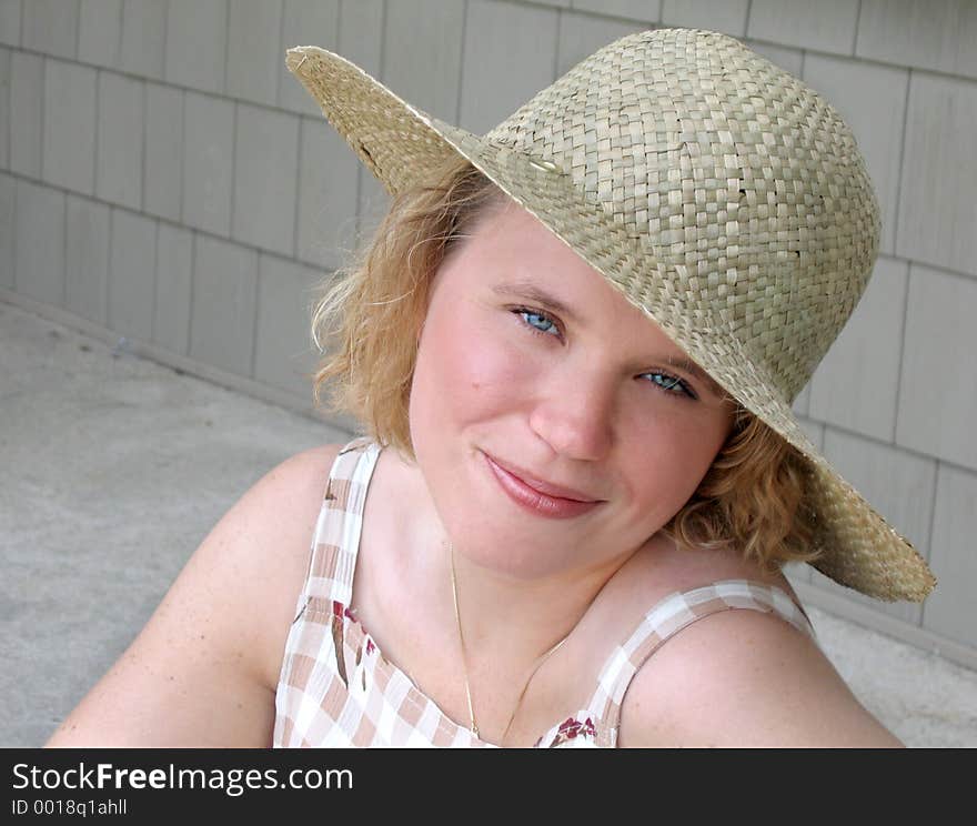 Beautiful young woman with straw hat. Beautiful young woman with straw hat