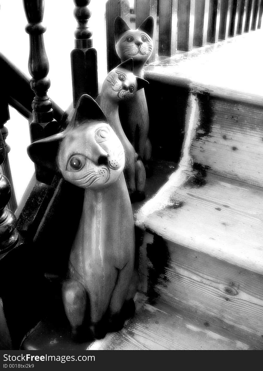 Wooden Cats on Stairs