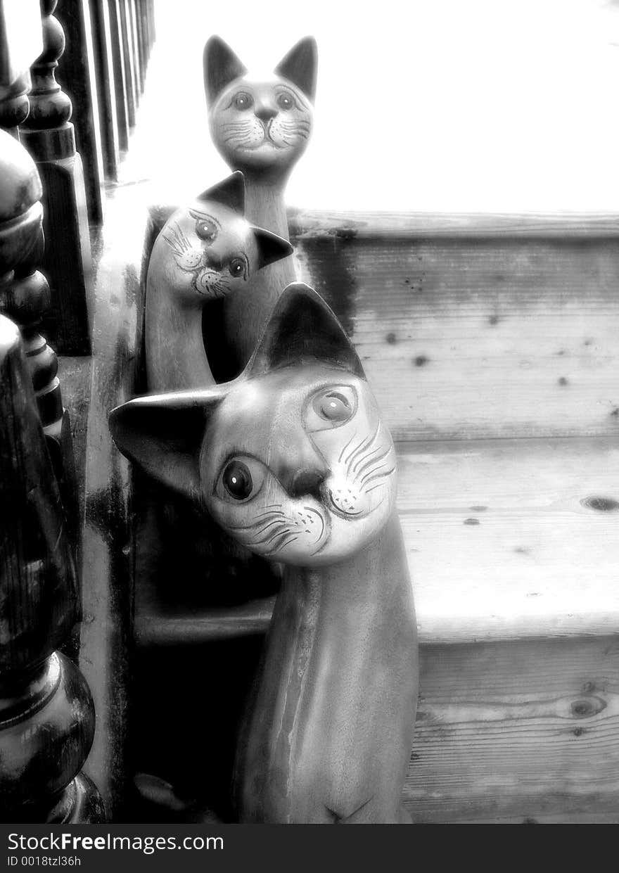 Wooden Cats on Stairs