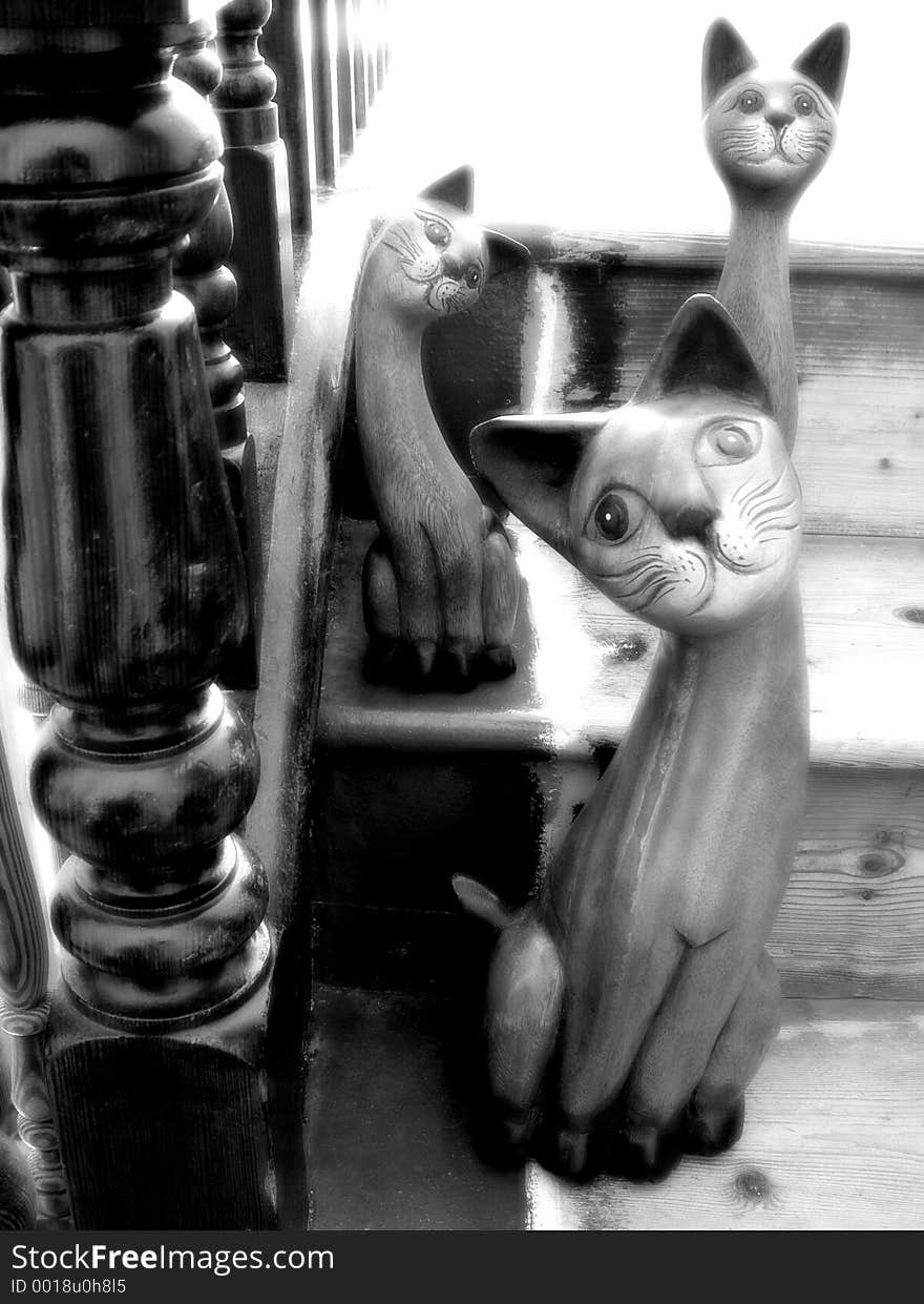 Carved wooden Cats on Old Stairs. Carved wooden Cats on Old Stairs